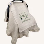 Bej örgü pike kumaştan, kenarları fırfırlı, kapak kısmı düz, kişiselleştirilebilir puset örtüsü.