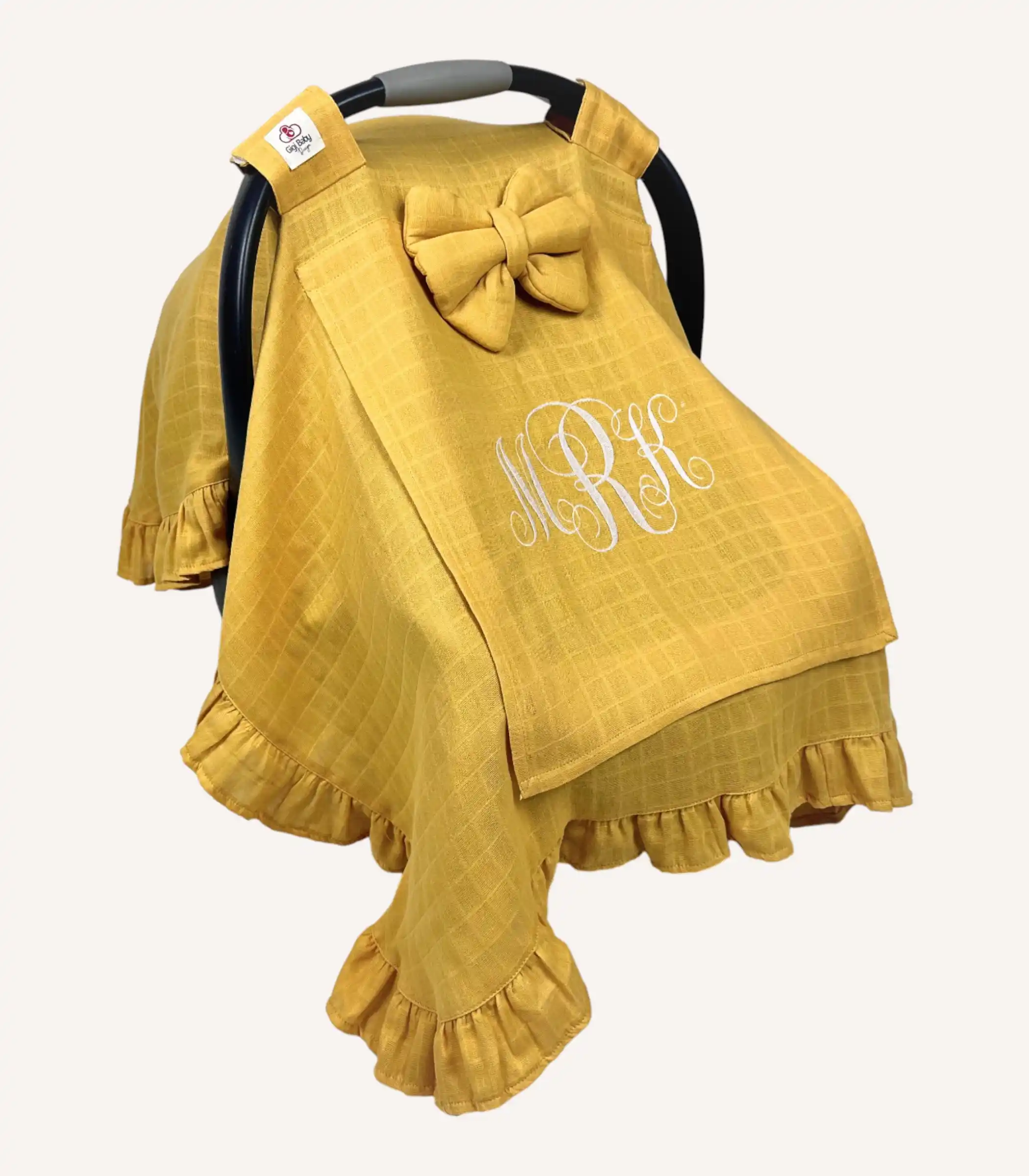 hardal-tek-kat-muslin-firfirli-puset-ortusu Hardal tek kat müslin kumaştan fırfırlı, kapaklı puset örtüsü; tül pencereli ve kişiselleştirilebilir nakış detaylı model.