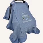 İndigo mavi örgü pike kumaştan, fırfırlı kenarlara sahip, sade kapaklı puset örtüsü.