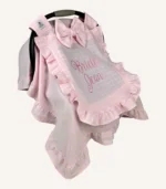 Pembe tek kat müslin kumaştan, fırfırlı kapak ve kenarlara sahip puset örtüsü.