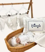 Ekru organik hastane çıkış seti; nakışlı dekoratif yastık ve battaniye, tulum, şapka ve yenidoğan kıyafet parçaları