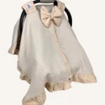 Bej müslin puset örtüsü, mini fiyonklu, ortadan yırtmaçlı çıtçıtlı model, akfil fırfırlı, tek kat hafif yazlık bebek puset örtüsü