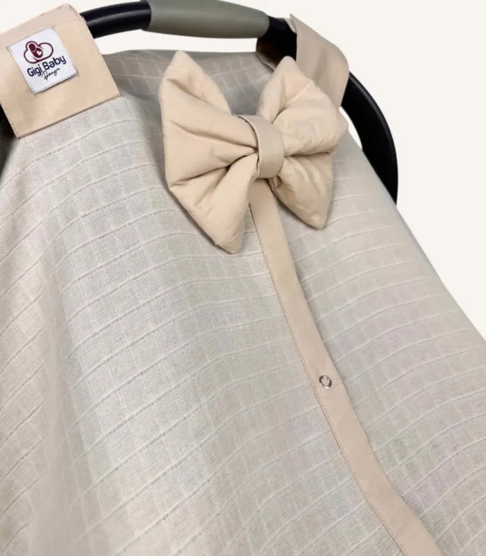 Bej müslin puset örtüsü, mini fiyonklu, ortadan yırtmaçlı çıtçıtlı model, akfil fırfırlı, tek kat hafif yazlık bebek puset örtüsü