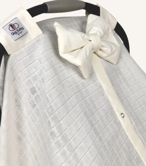 Krem müslin puset örtüsü, mini fiyonklu, ortadan yırtmaçlı çıtçıtlı model, akfil fırfırlı, tek kat hafif yazlık bebek puset örtüsü