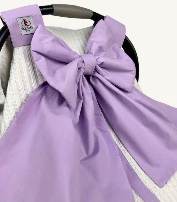 Krem örgü pike puset örtüsü, lila fiyonklu, ortadan yırtmaçlı çıtçıtlı model, fırfırlı kenarlı, %100 pamuk bebek puset örtüsü