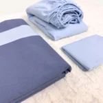 Bebek mavisi ve indigo mavi renk bloklu pamuklu tek kişilik nevresim takımı, lastikli çarşaflı modern yatak seti