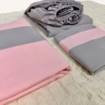 Pembe ve gri %100 pamuk tek kişilik nevresim takımı, lastikli çarşaflı, modern renk blok tasarımlı yatak seti